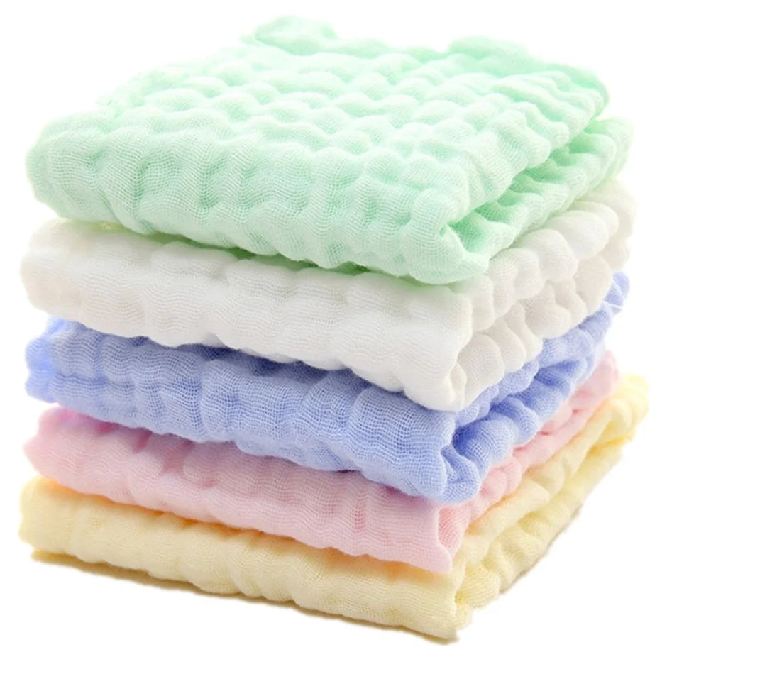 Stack of colorful baby blankets on a white background